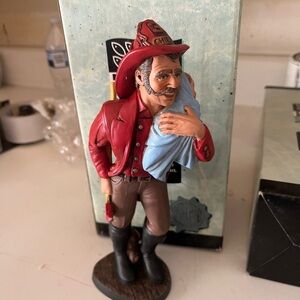 Benton Studios collectibles 
Firefighter with baby
Original box
